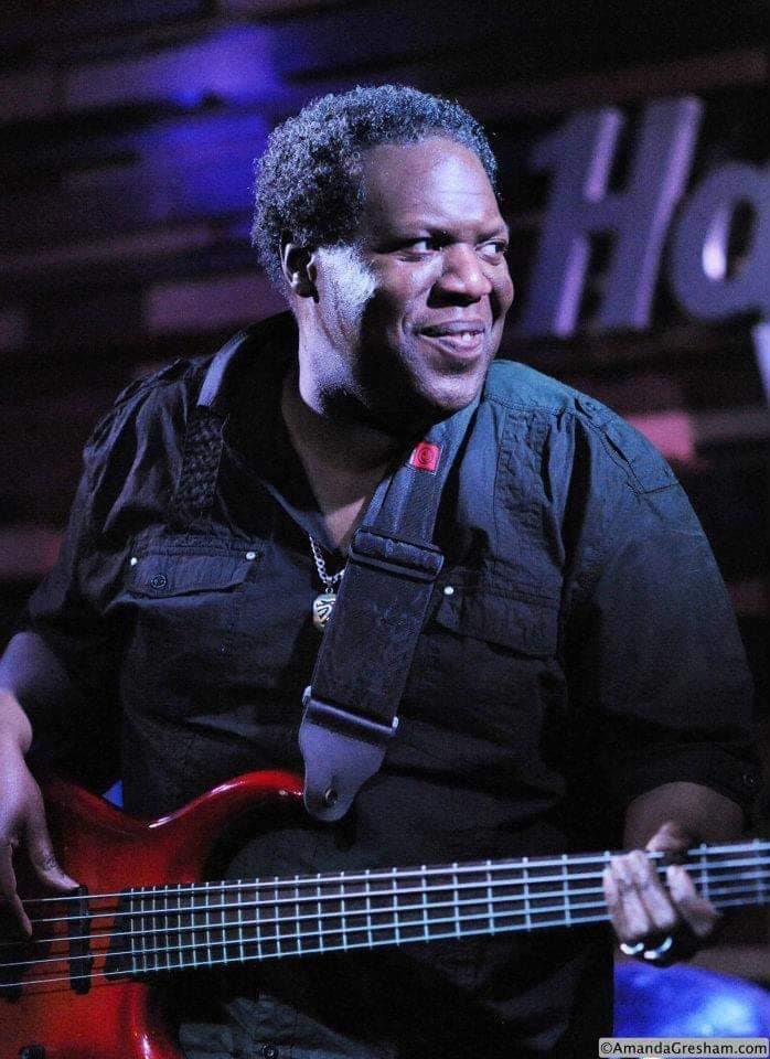 Marquita’s stepfather playing guitar